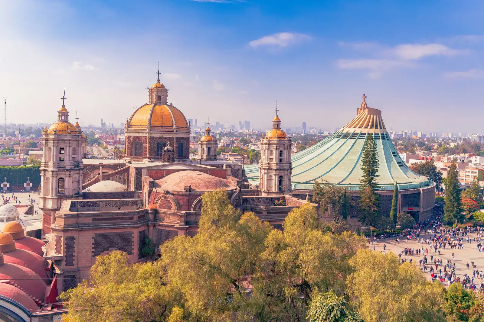 A stunning aerial view of the Basílica de Guadalupe in Mexico City, showcasing iconic architecture and vibrant city life.